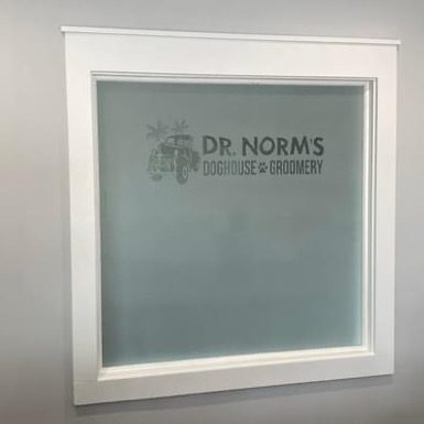 A window with the name of dr. Norms in it